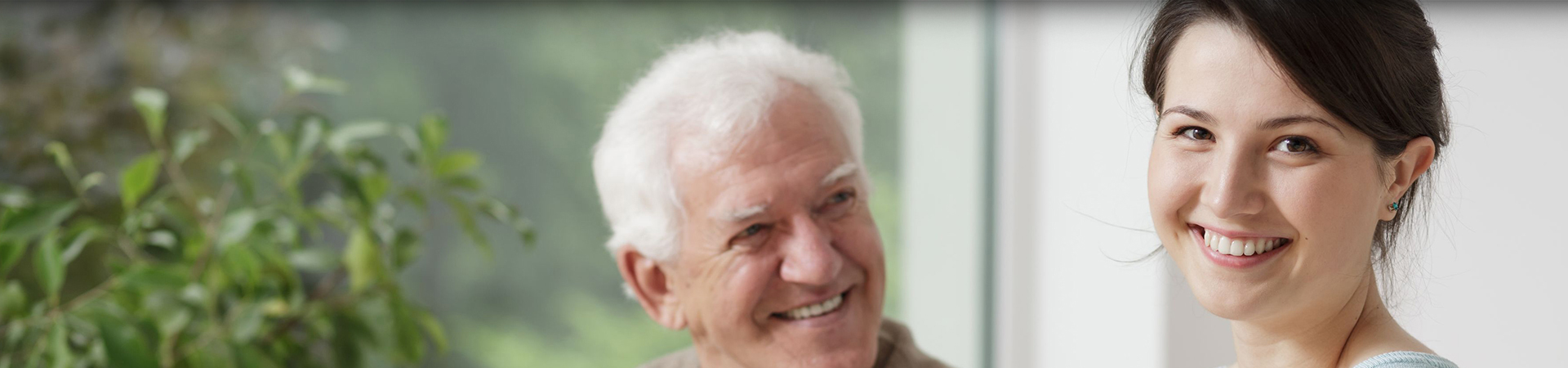 A man with white hair smiling for the camera.