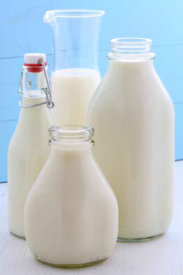 Three milk jugs are shown next to each other.