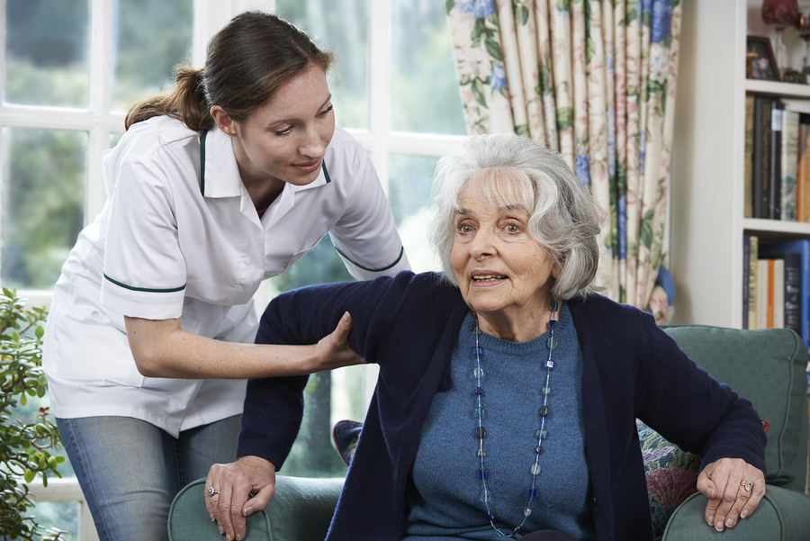 A woman and an older person in a room.