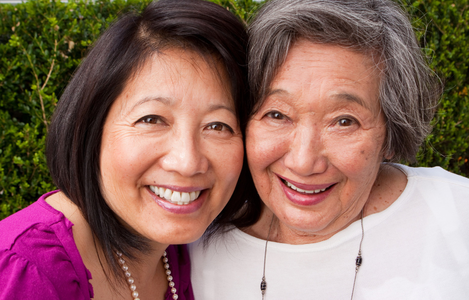 Two women smiling for a picture together.