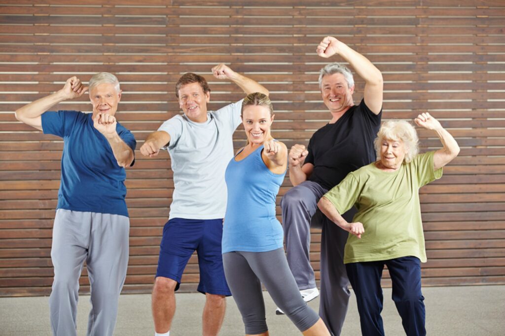 A group of people doing different exercises together.